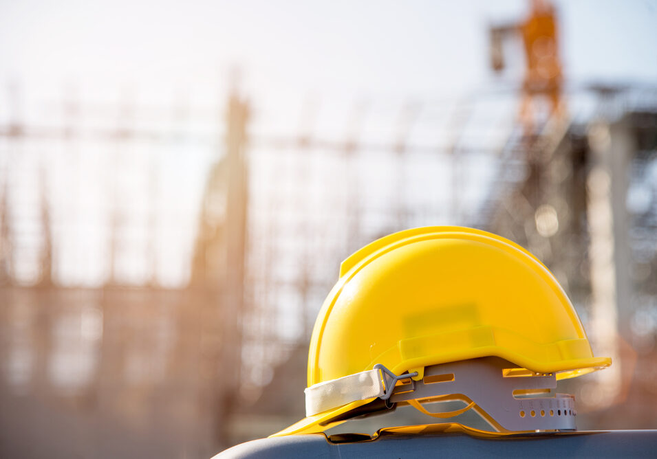 Helmet,In,Construction,Site,And,Construction,Site,Worker,Background,Safety